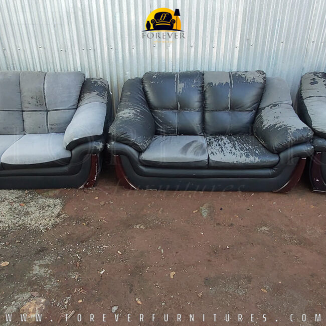 Image of a black leather sofa set BEFORE it was re-upholstered by Forever Furnitures