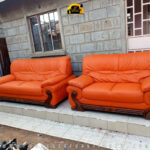 Image of a bright orange sofa set after it was re-upholstered by Forever Furnitures