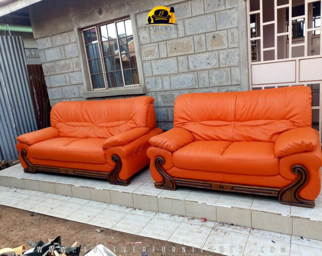 Image of a bright orange sofa set after it was re-upholstered by Forever Furnitures