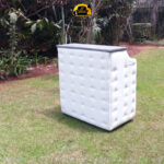 Image of a white cushioned podium stand crafted by Forever Furnitures